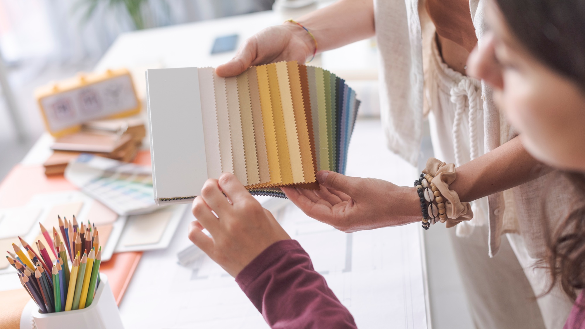 Interior designers checking fabric swatches